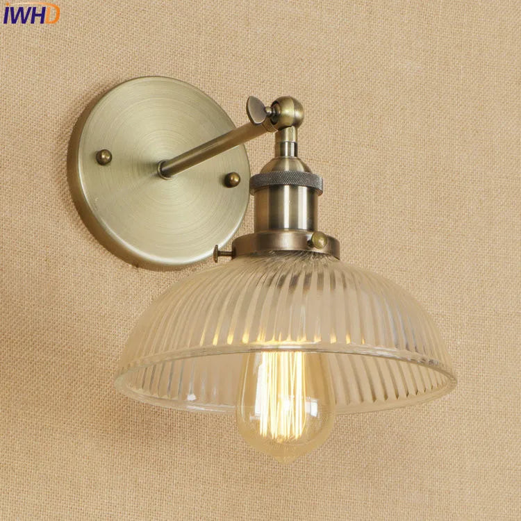 brass wall sconce, detail view of fixture base and arm