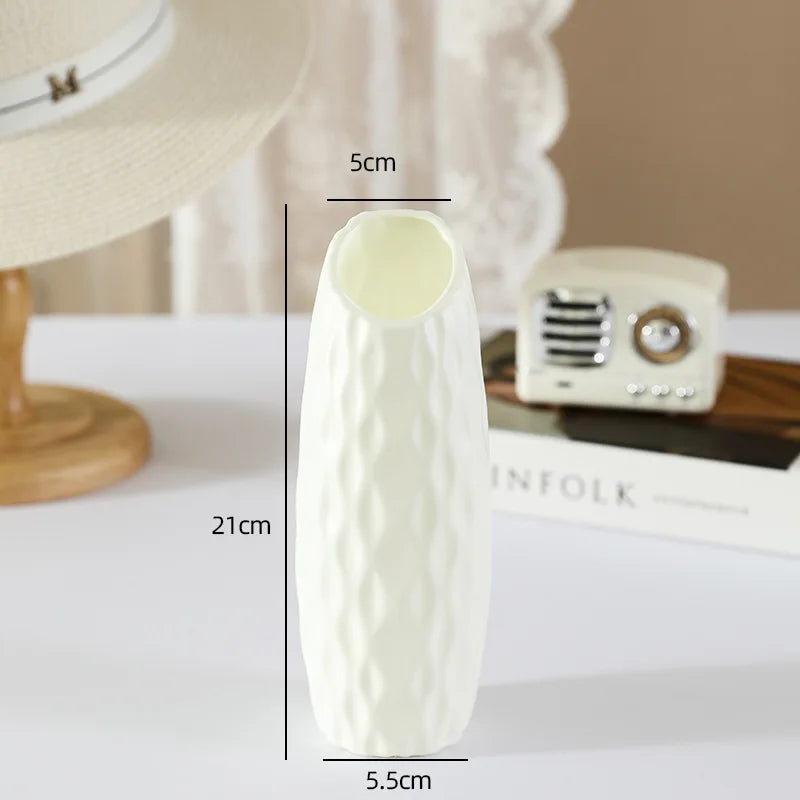 Nordic sculpted plastic vase with dried pampas grass on home shelf styling