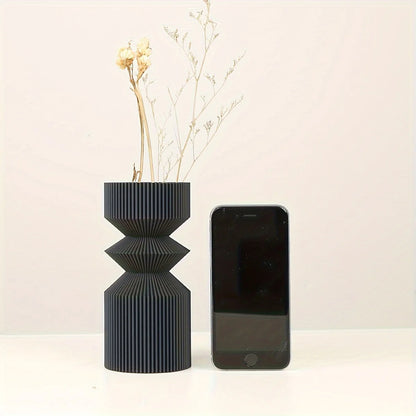 Close-up of smooth matte black plastic surface on Nordic style vase