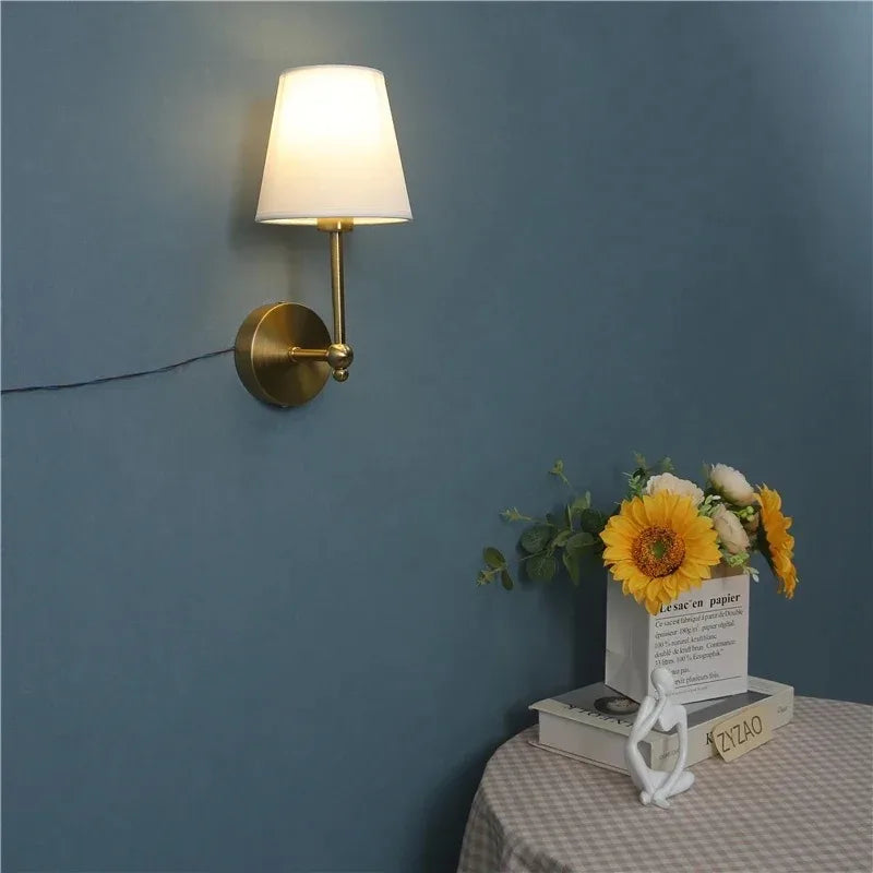 fabric shade bathroom wall sconce, installed in a room interior setting
