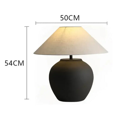 Nordic ceramic table lamp switched off showing natural clay silhouette