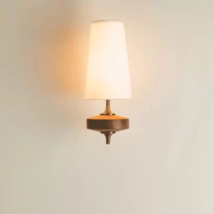 fabric shade wall sconce, installed in a room interior setting