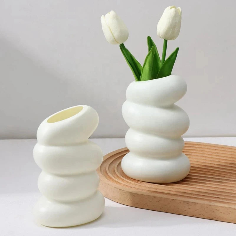 White plastic spiral twist vase for fresh flowers in Nordic Scandinavian style