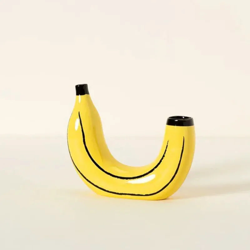 Close-up of sculptural resin banana form vase showing surface detail