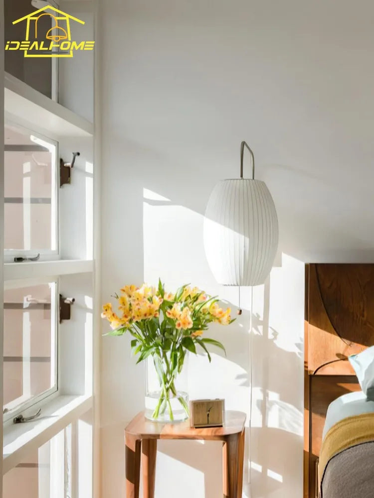 silk wall sconce, detail view of fixture base and arm