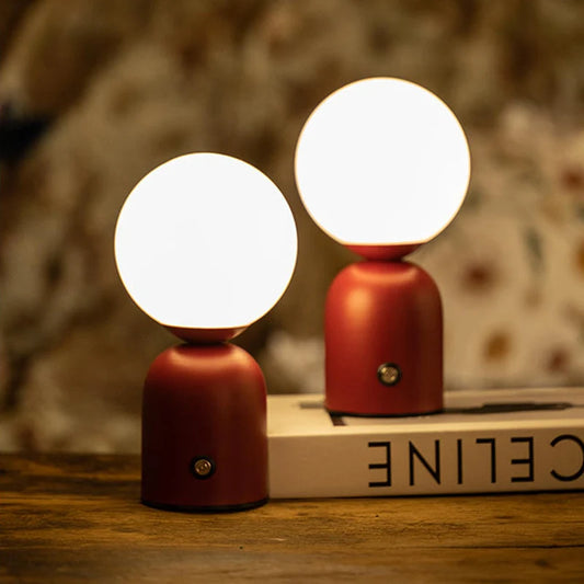 Type-C rechargeable LED desk lamp in red on study desk front view