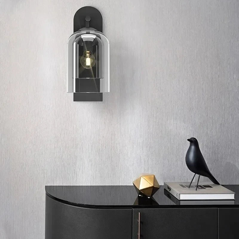 glass bathroom wall sconce, detail view of fixture base and arm
