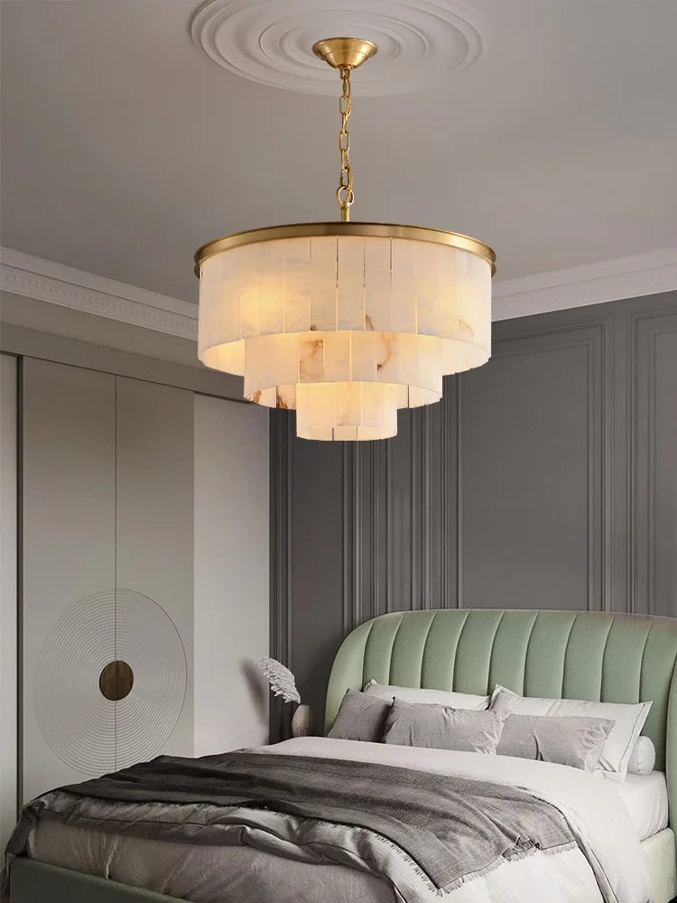 Single light marble chandelier with a polished steel stem in gold