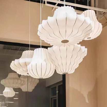 Hand knitted white silk shade wrapped over the chandelier metal frame