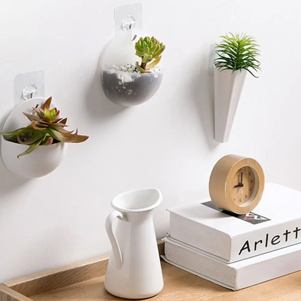 White semicircle wall hanging acrylic planter in Scandi minimalist hallway