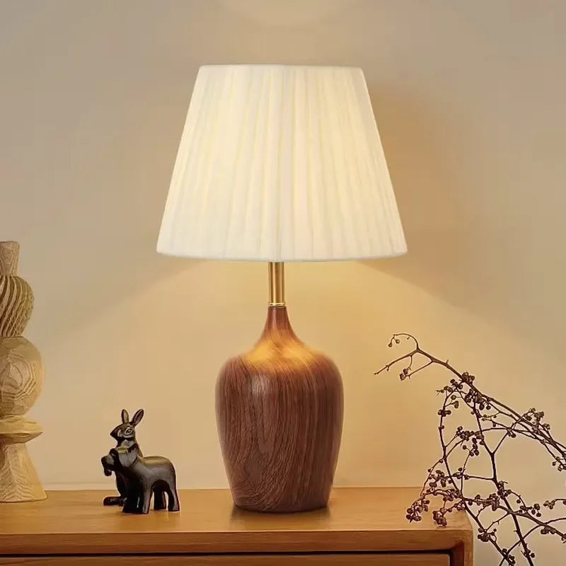 Solid wood vase lamp base showing natural walnut grain texture detail