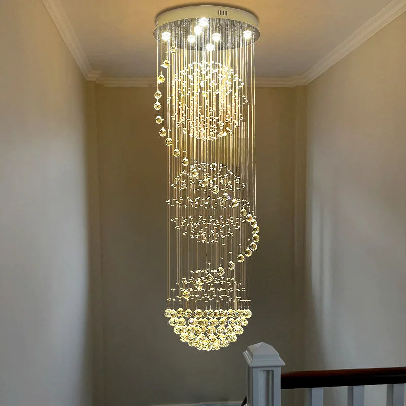 Clear K9 crystal falling in a spiral from a polished steel canopy