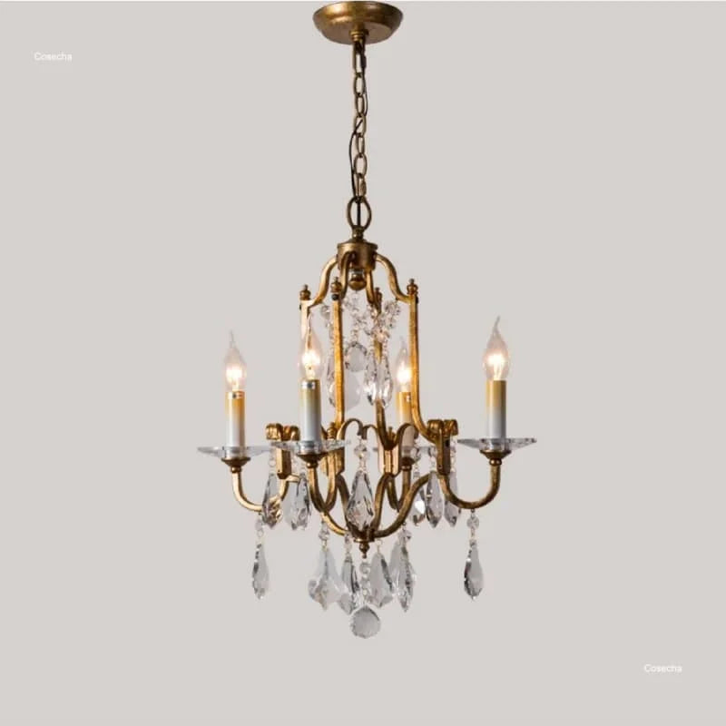 Antique brass style chandelier with crystal drops on curved arms