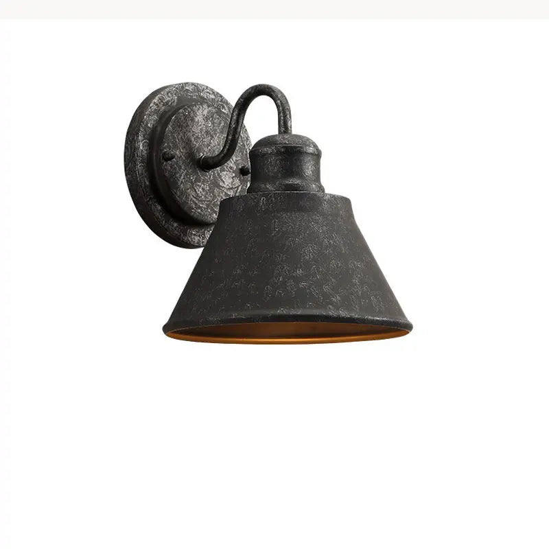 iron outdoor wall sconce, detail view of fixture base and arm