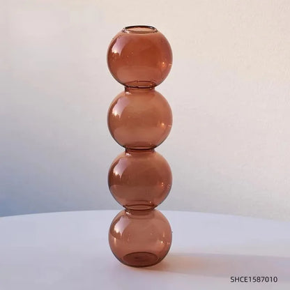 Champagne colored geometric terrarium vase as biophilic windowsill indoor display