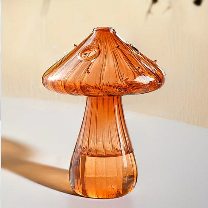 Yellow glass mushroom hydroponic planter with small decorative plant inside