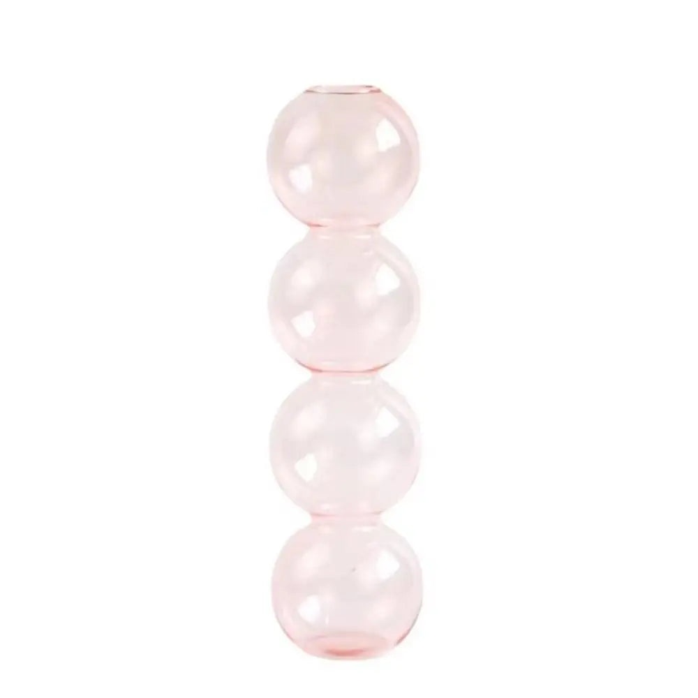 Glass transparent-S hydroponic vase on marble bathroom surface with single leaf cutting