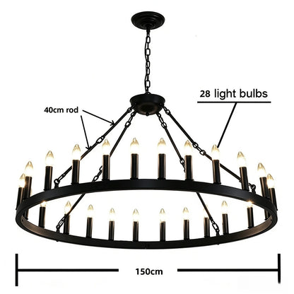 Wrought iron candle chandelier lit in white light on black rings
