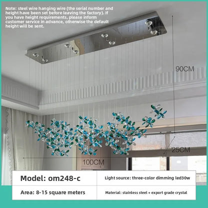 Iron frame crystal chandelier in green with neutral light LED bulbs