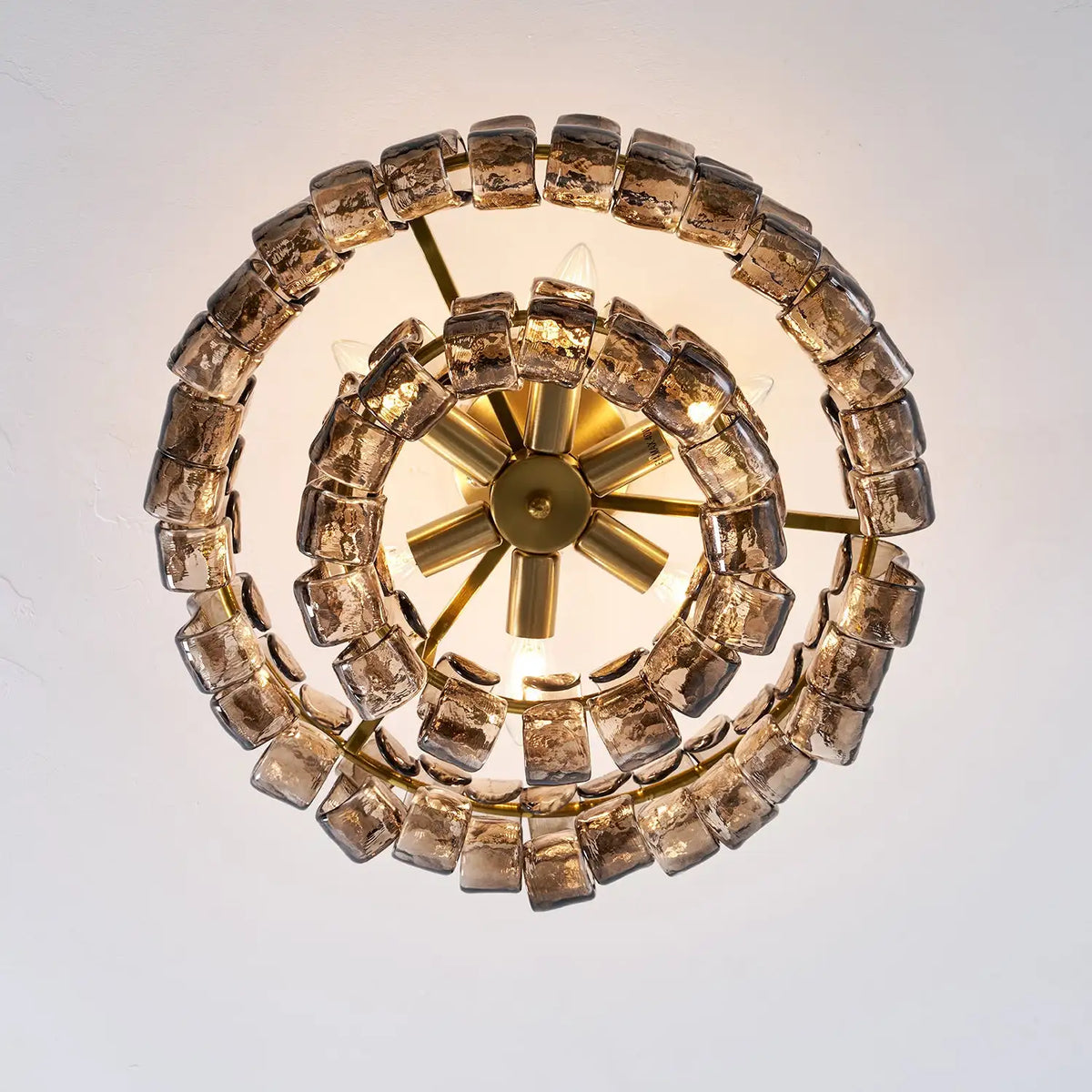 Golden metal glass chandelier with up and down light for a restaurant table