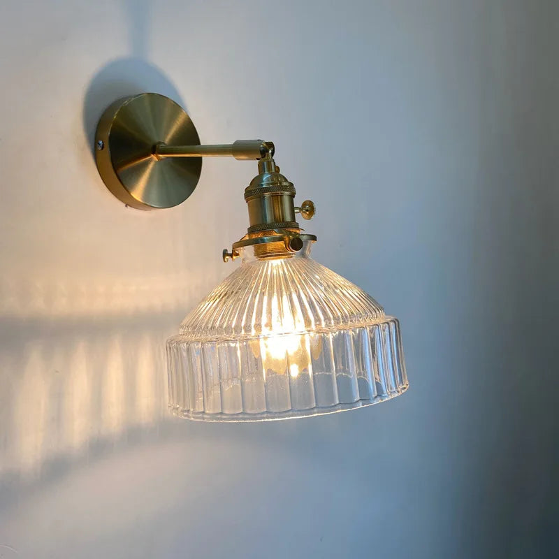 green glass bathroom wall sconce, installed in a room interior setting