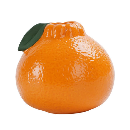 Two ceramic fruit table vases in orange and neutral colorways together