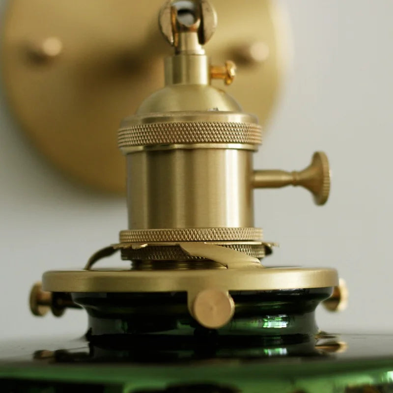 glass wall sconce, detail view of fixture base and arm