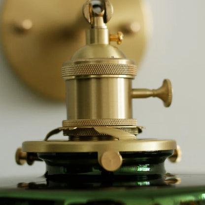 glass wall sconce, detail view of fixture base and arm