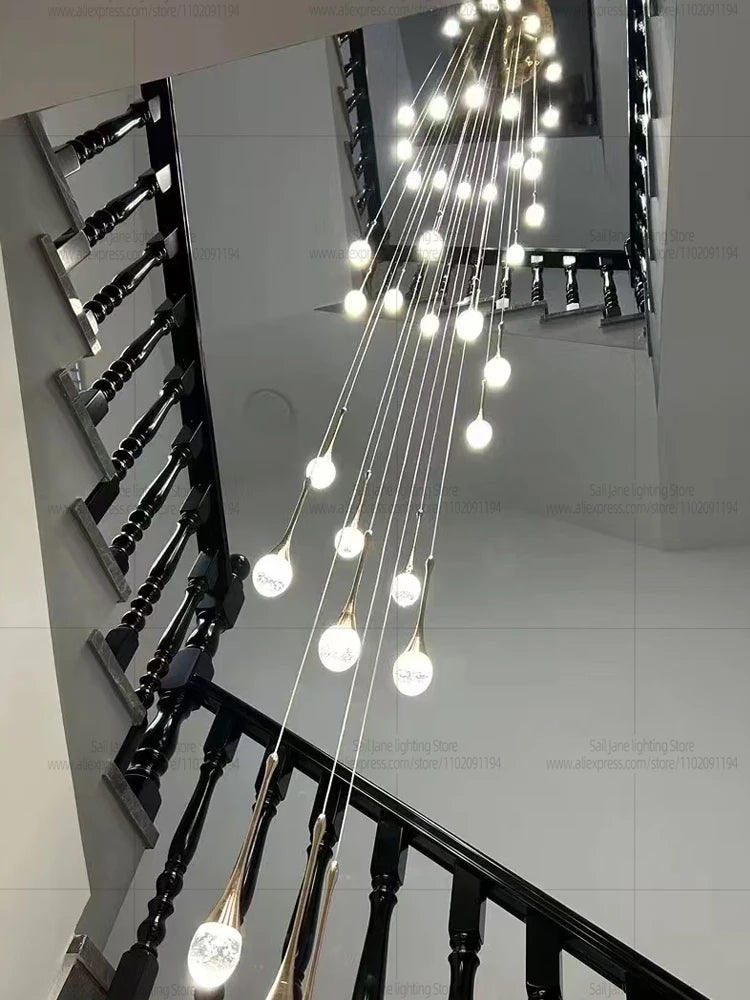 Golden lamp body chandelier with crystal raindrops on hanging cables