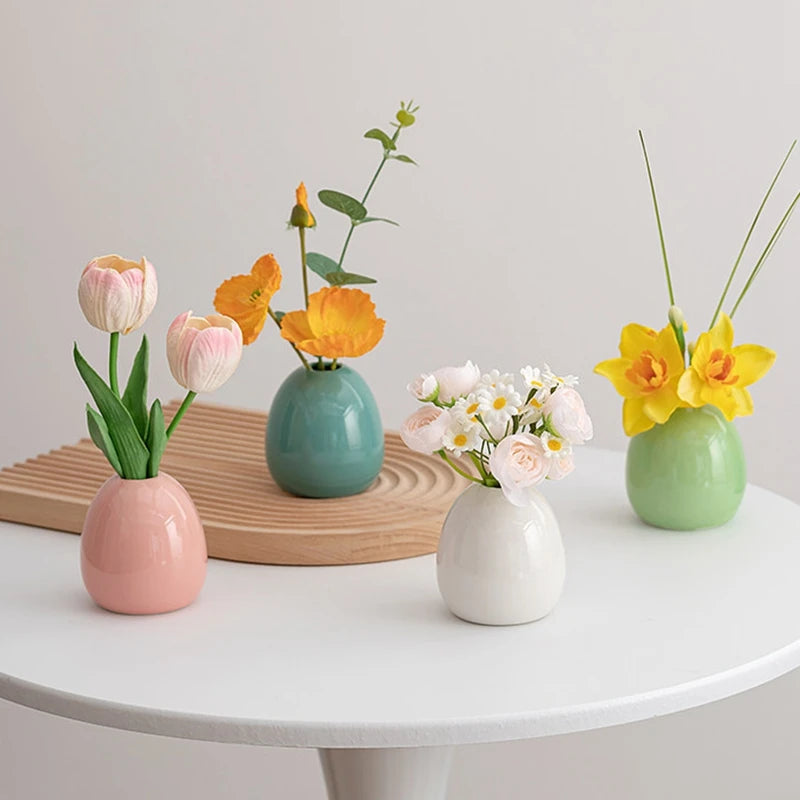 Mini ceramic vase collection multiple styles on white table