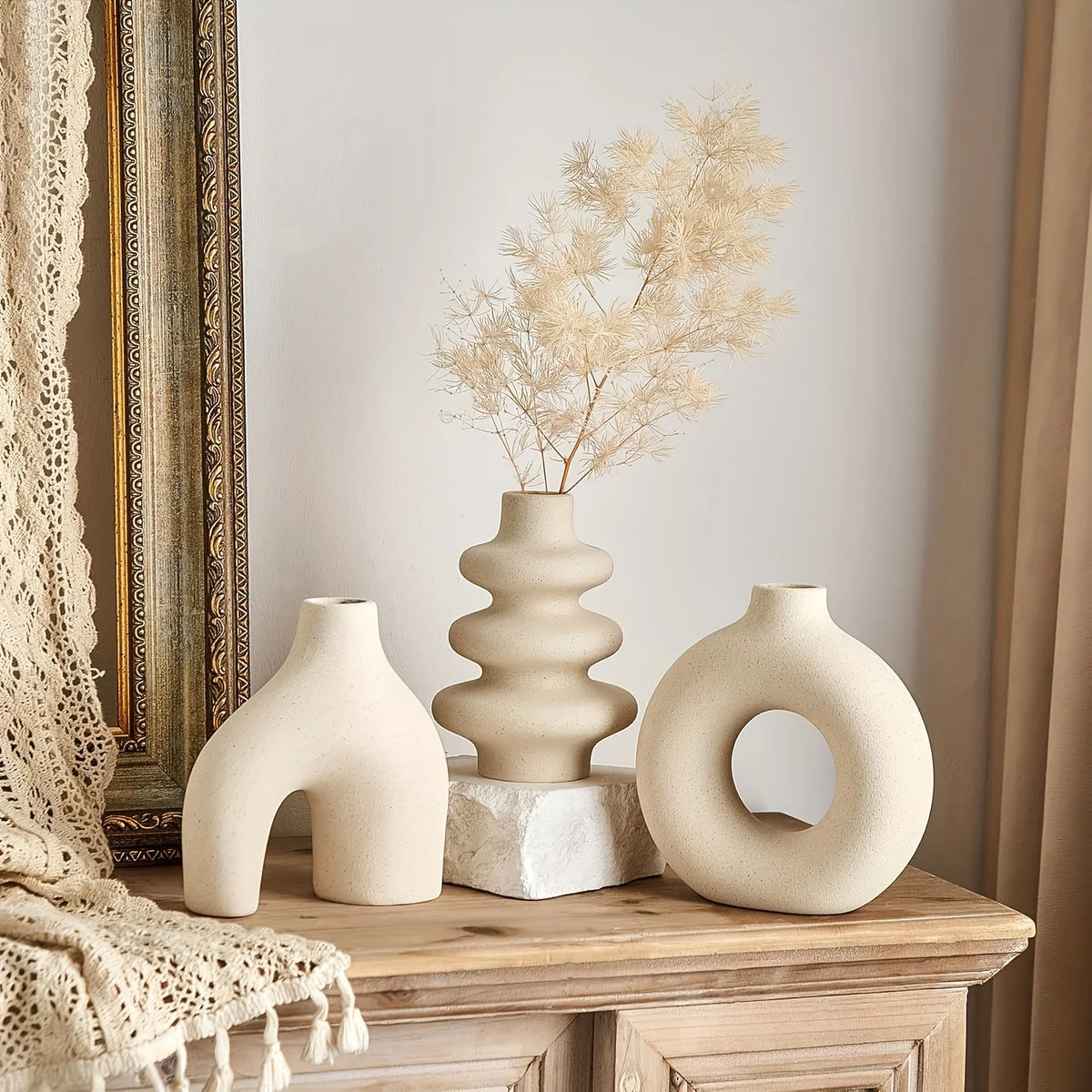 Bohemian ceramic vase set in black matte finish on a boho living room shelf