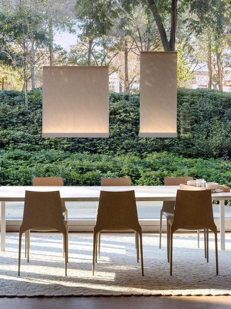 Plain dyed fabric panels on a polished steel chandelier frame