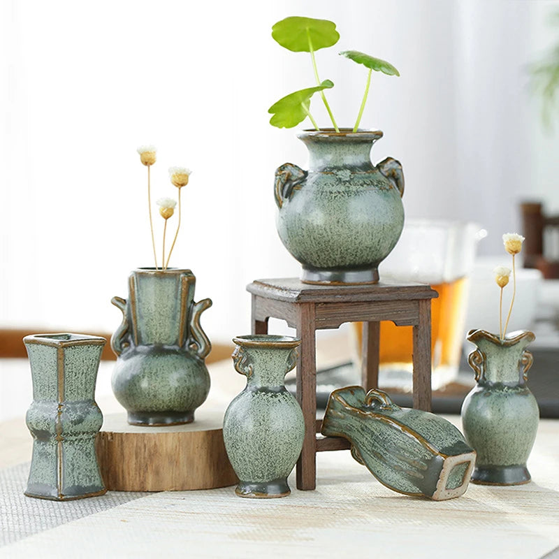 Retro green ceramic bud vase with single stem flower