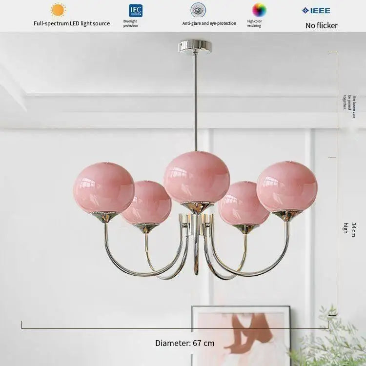 Frosted glass ball chandelier lit in cool white from built in LED chips