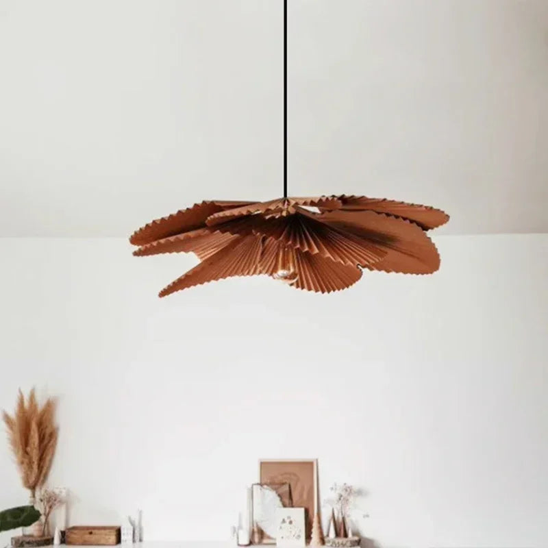 Pleated paper chandelier shown in a neutral toned interior