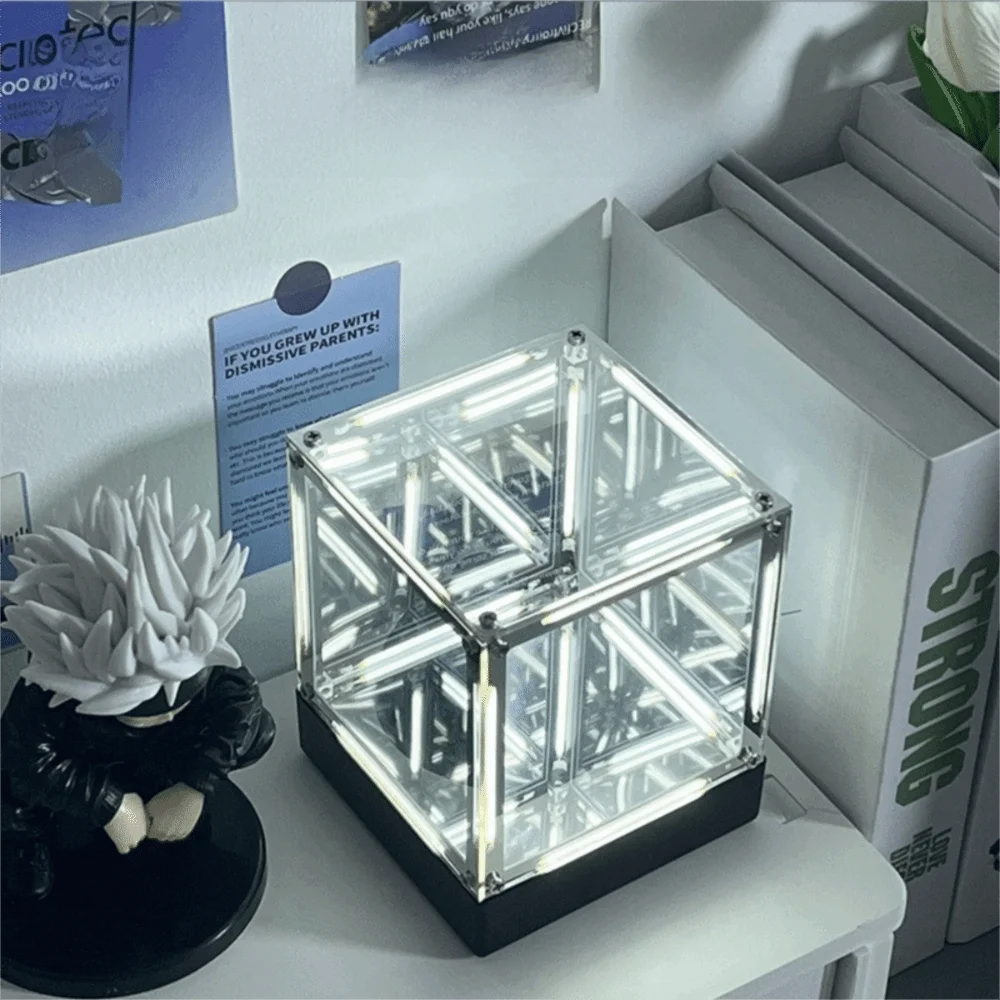 White triangle maglev hypercube night light with LED glow underneath base