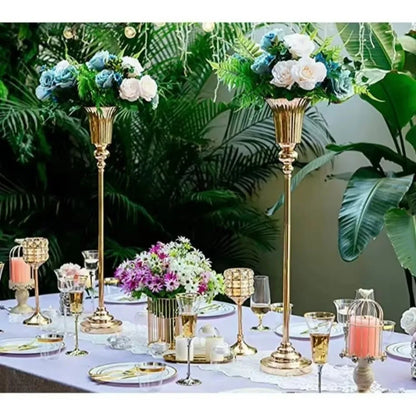 Three silver metal flower stand vases in S M and L sizes arranged as decorative collection