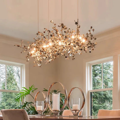 Sculptural stainless steel chandelier with mirror finished plated heads