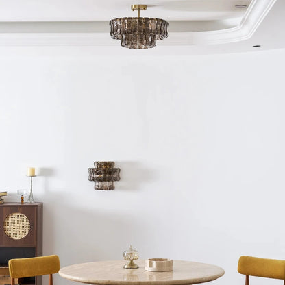 Handcrafted glass element detail on a gold iron chandelier frame
