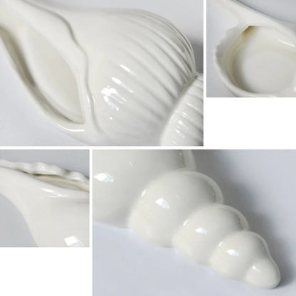 Left-mouth white ceramic shell wall vase close-up with matte glaze detail