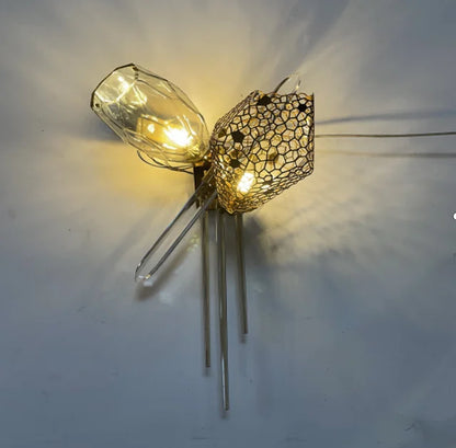 Linear glass chandelier, 39.4 by 16.9 inches, above a dining table