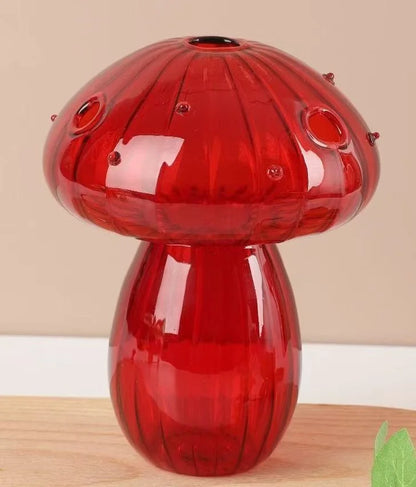 Mini mushroom glass vase used as single flower stem display on table