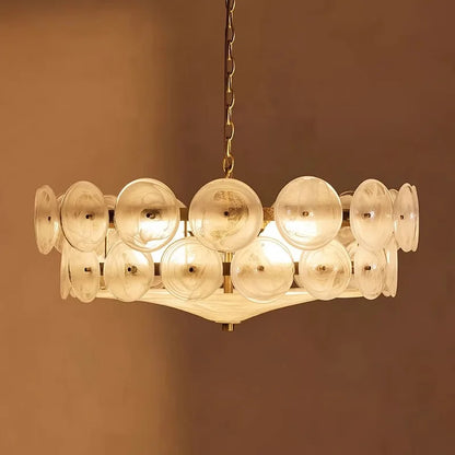 Modern chandelier with rounded clear glass shades on a low iron frame in green