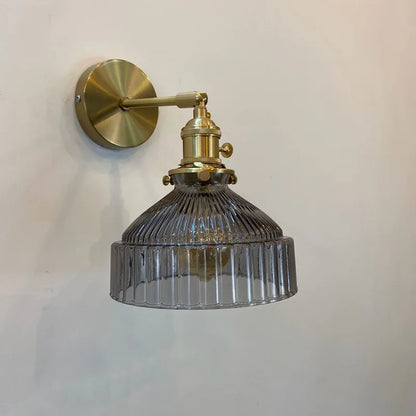 green glass bathroom wall sconce, detail view of fixture base and arm