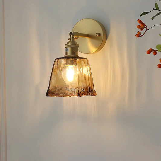 brass wall sconce, front view on white background