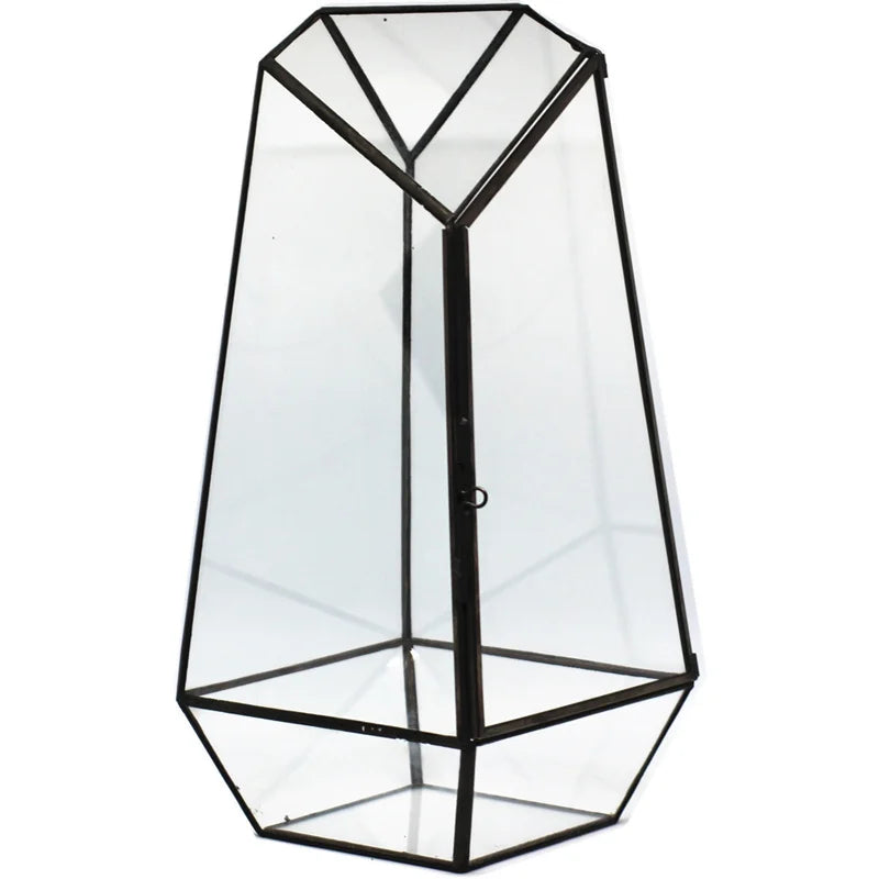 Clear irregular quartz glass terrarium with layered moss and botanical arrangement inside