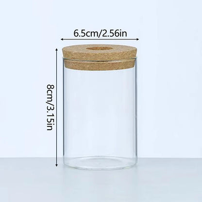 Side view of glass self-watering planter showing integrated tray water reservoir