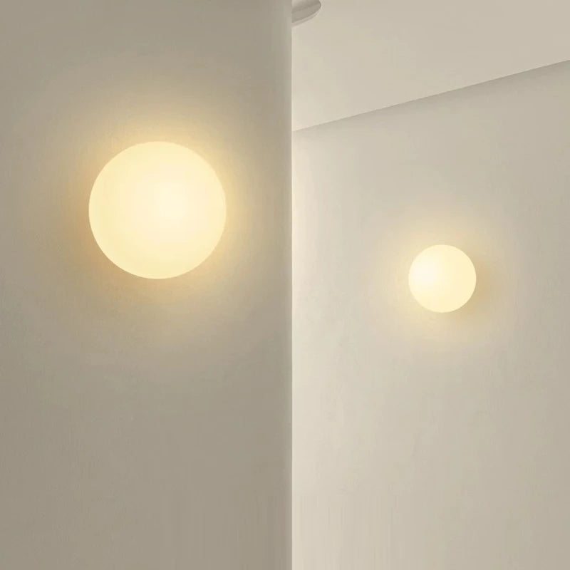 glass bathroom wall sconce, side profile showing mounting depth