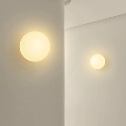 glass bathroom wall sconce, side profile showing mounting depth