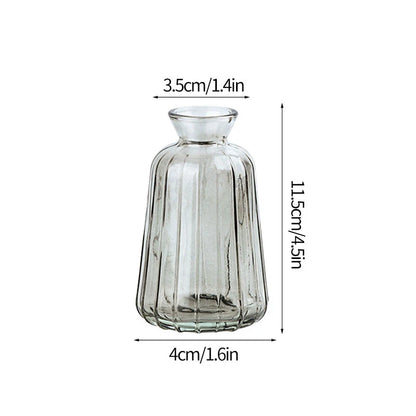 Clear glass floral vase styled on dining table for event